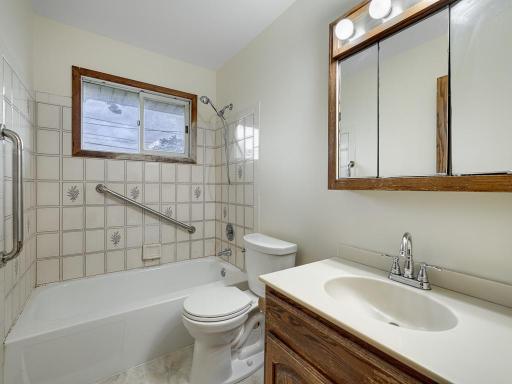 The full bathroom is located near the bedrooms and has a new LVP floor matching the kitchen.
