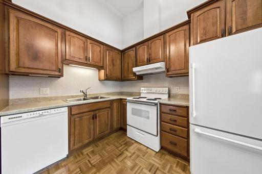 Kitchen with hardwood floors and nice cabinetry!