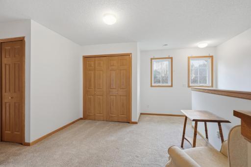 Loft area and door to laundry closet. There is a large hallway linen closet just outside the full bath and all three bedrooms.