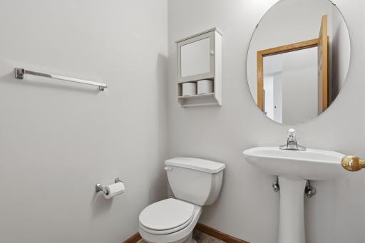 The main floor half-bath is conveniently located near the entrance from the garage.