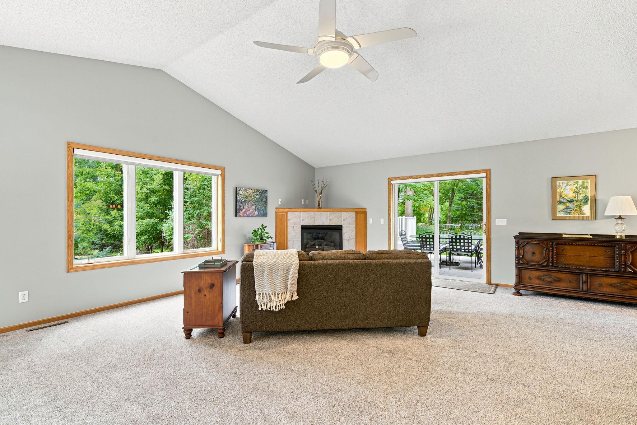 Living room has gas fireplace and sliding door to new decks.