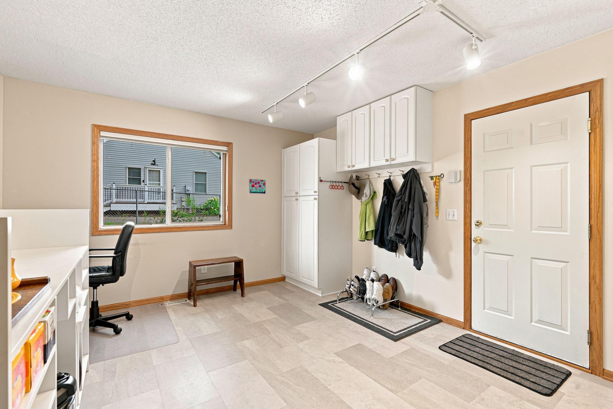 Amazing back hall off the garage with ample space for planning desk, coats and gear.