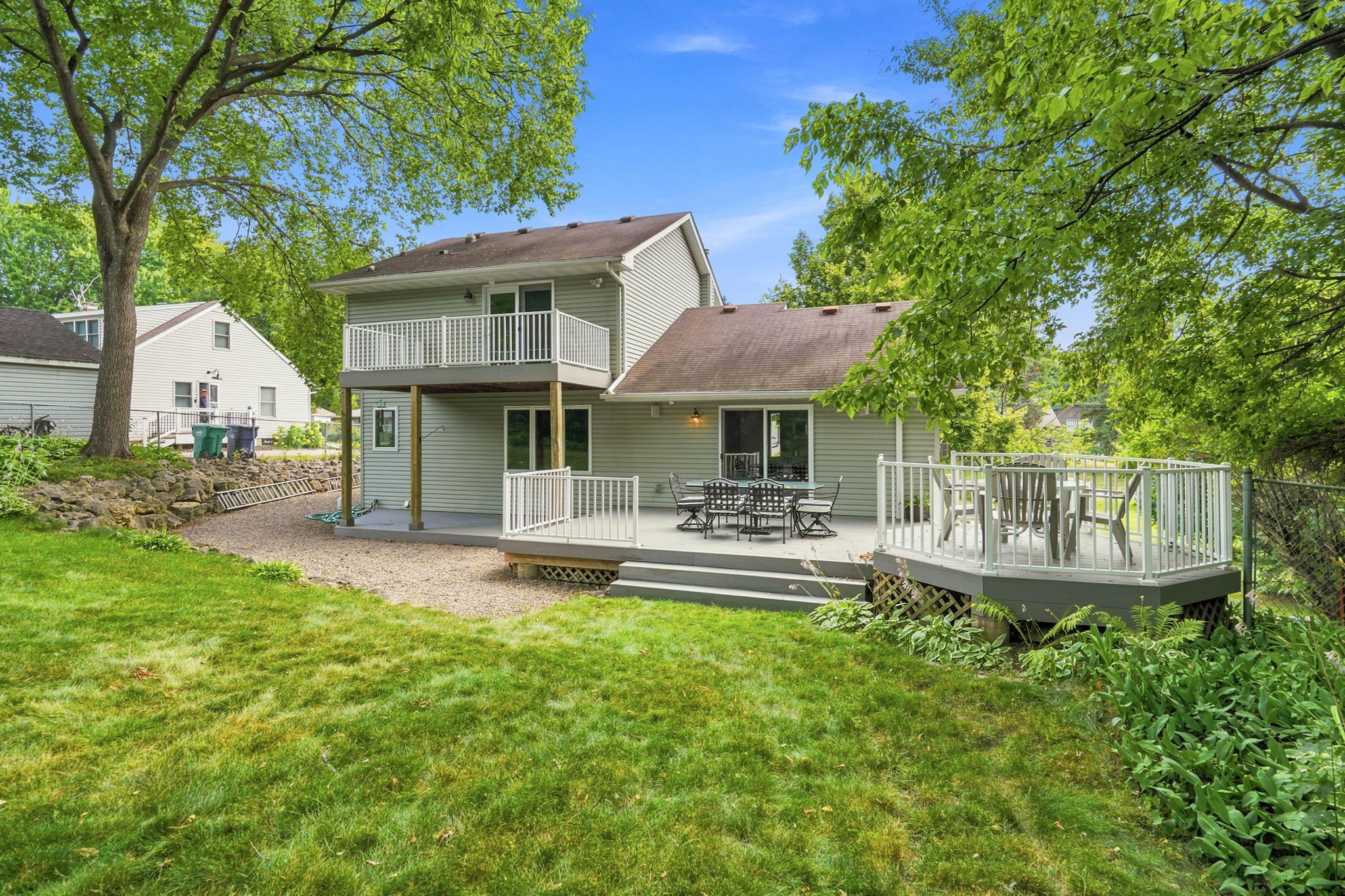 Rear view of home shows the decks and outside eating hexagon area.