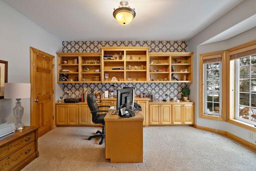 Large main floor office with walk inclosed and built in shelving
