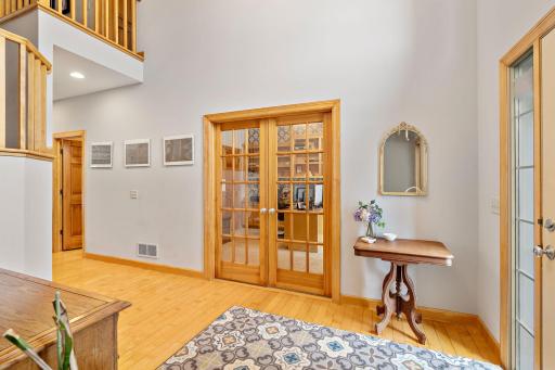 Glass French doors provide privacy for the office