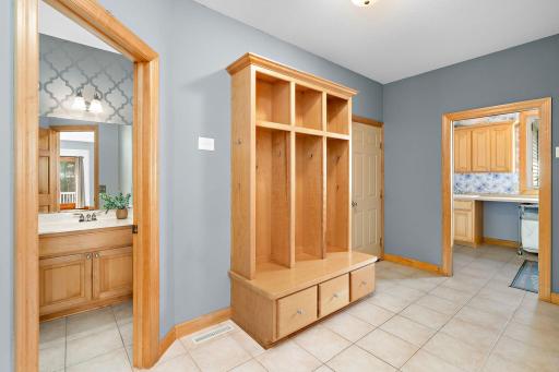 Oversized mudroom with built in lockers and large closet.