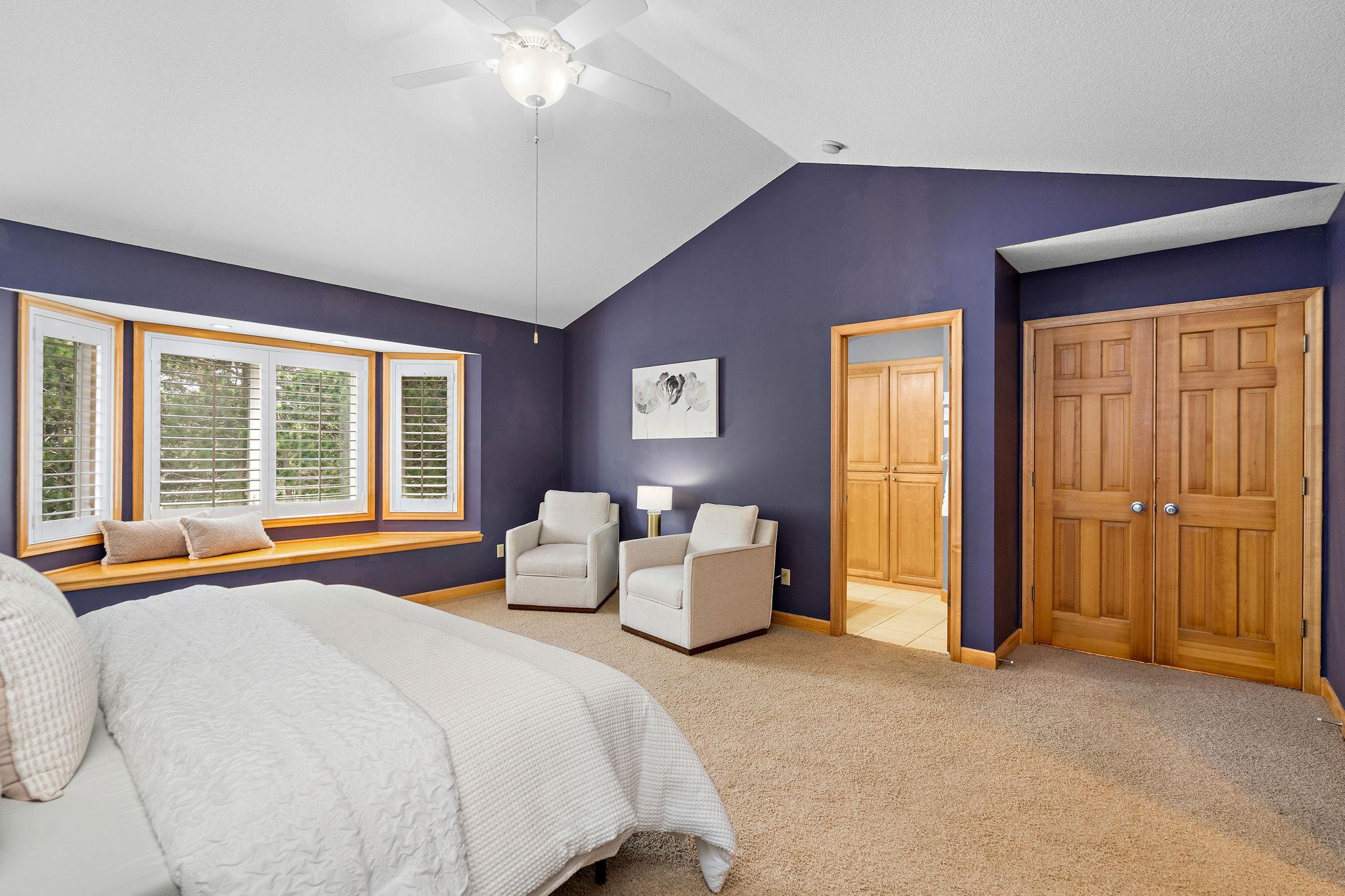Sitting are in primary with bay window seat - vaulted ceiling