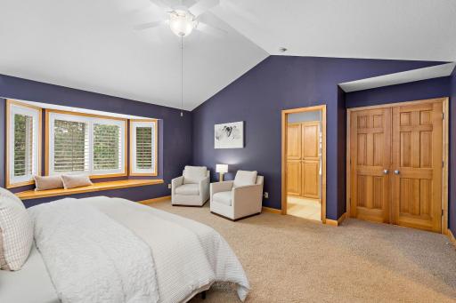 Sitting are in primary with bay window seat - vaulted ceiling