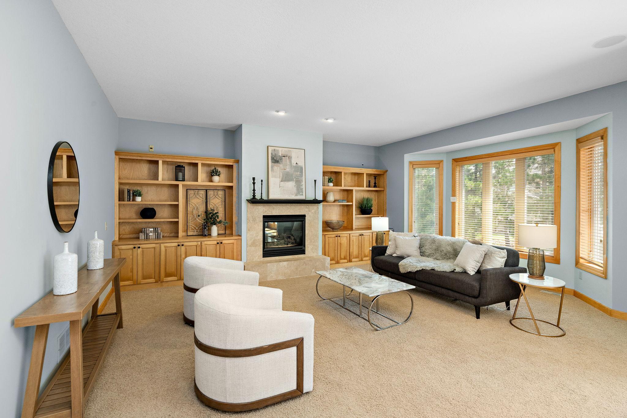 Main floor family room off of dinette with built-in-shelving and gas fireplace