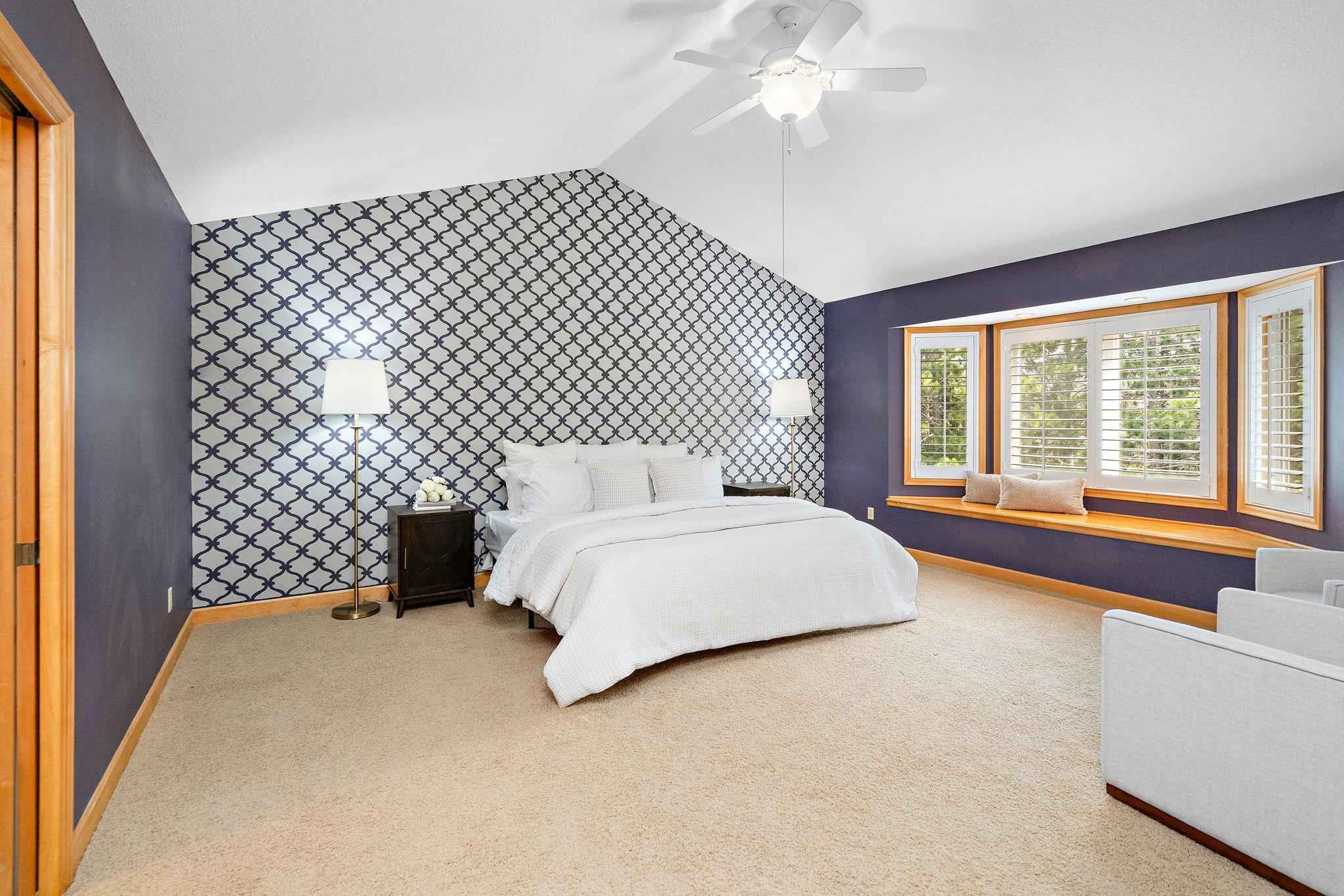 Spacious Primary suite with double doors and sitting area