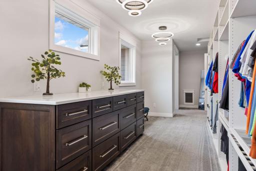 The spacious closet also features - Layered lighting – three bubble glass chandeliers 3000k, Layered lighting – above closet lighting 2500k.