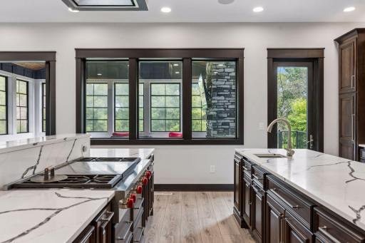 Kitchen and dining both have under/above cabinet lighting, quartz countertops, which is also the backsplash.