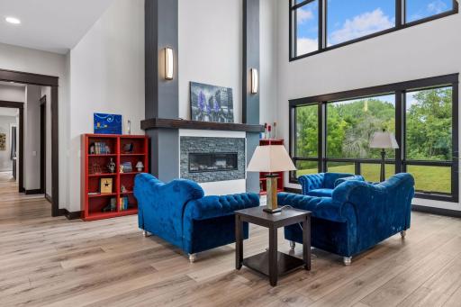 Your living room with spacious picture windows overlooking the vast backyard!