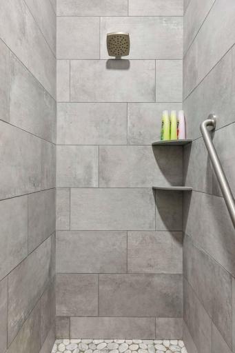 Bathroom shower with 36” wide for wheelchair access if needed and grab bar.