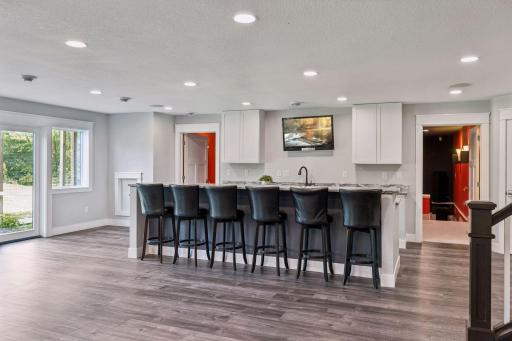 Kitchenette with double doors leading to the back patio.  Great space for hosting the big game!