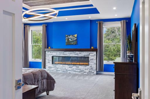 Light switches for each side of the bed in 2 places for options. These switches control the fireplace outlet and tray ceiling lighting.