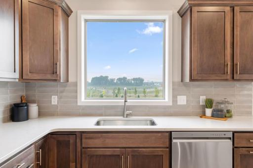 Oversized window above sink to overlook backyard