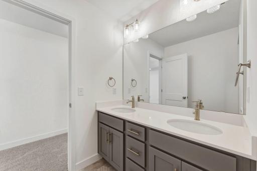 Vanities in upper level hall bath