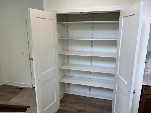 Pantry right between mudroom and kitchen. Convenient for putting away groceries.