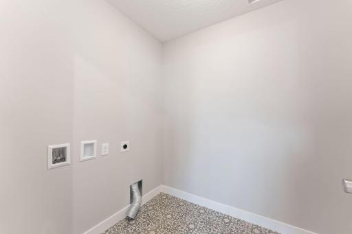 Laundry room has hook-ups for washer and electric dryer