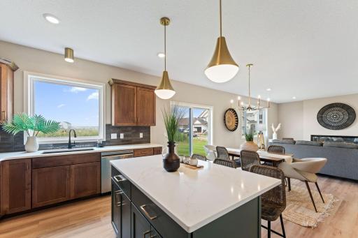 Large window at sink overlooking backyard