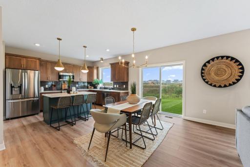 Dining room with sliding glass door leading to backyard