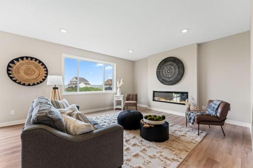 Continuous flooring in foyer, family room, dining room, and kitchen
