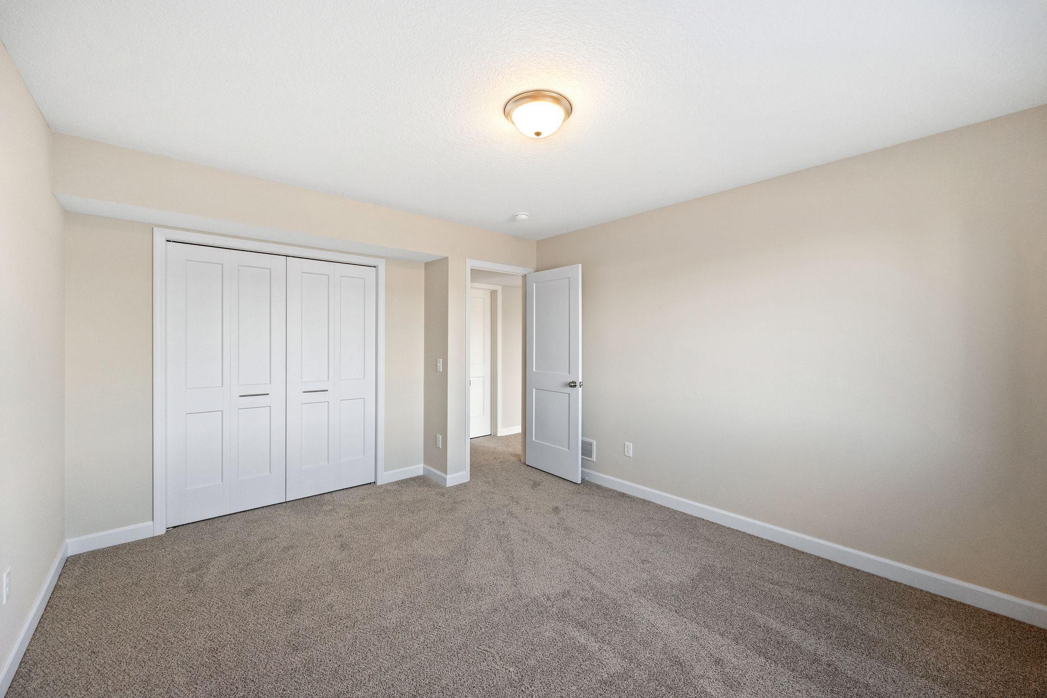 Bedroom #5 in lower level -- this photo is not this exact home, but one of the same floorplan