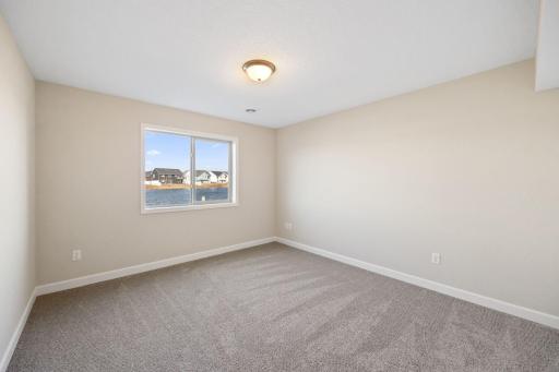 Bedroom #5 in lower level - this photo is not this exact home, but one of the same floorplan