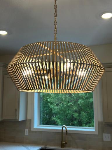 Brushed gold accents in the kitchen with the light fixture