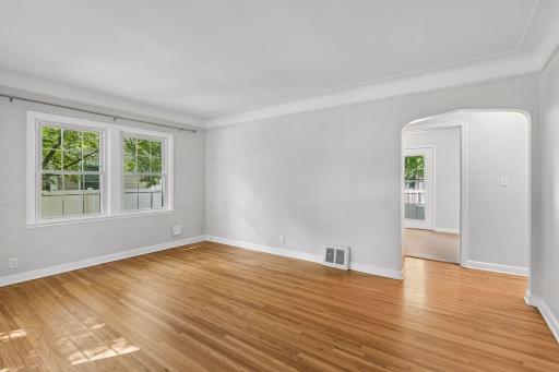 Coved ceilings and arched doorways add to the character of this home