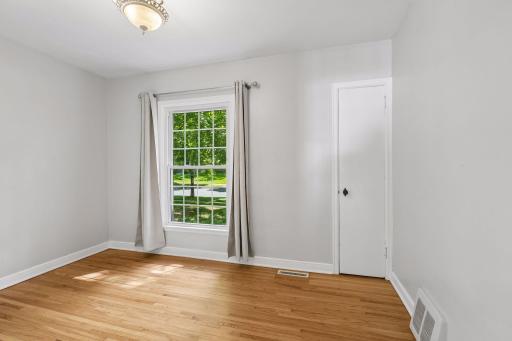 This room features hardwood floors with white woodwork