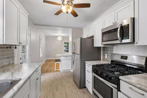 White cabinets accentuated with stainless appliances complete the fresh look