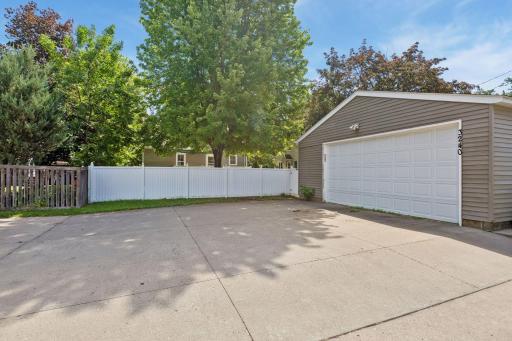 There is a large concrete driveway that provides plenty of off street parking