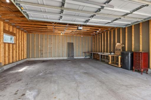 The newer oversized garage measures 23x23 and has a 16x8 garage door