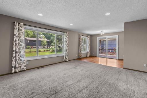 Upgraded windows (2022) offer picture perfect views of the fenced in backyard.