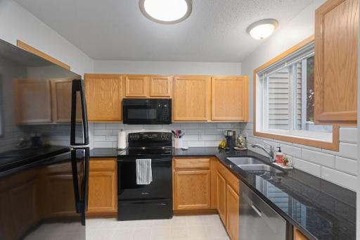 New lighting, fresh paint, new tile backsplash!
