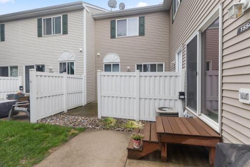 This sweet patio is located at the back of the home and gets lots of morning/afternoon sunshine -- container gardens would work well in this space!