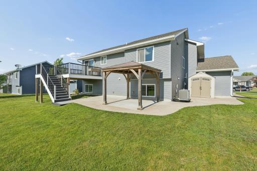 1149 Wyoming St - Expansive Concrete Patio with Pergola That Wraps to Side of Home and Shed
