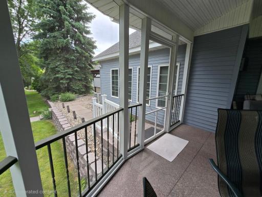 View of path from granite floor deck to the sheltered hot tub and back service door to the double garage area.