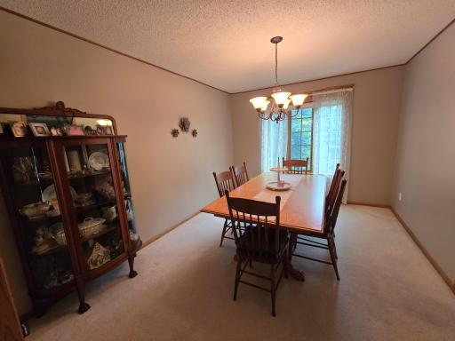 Full formal carpeted dining room area