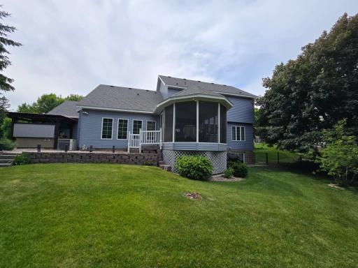 To the left of the home is the sheltered spa that can be accessed by a sidewalk off the 3 season deck porch or the back door of the garage