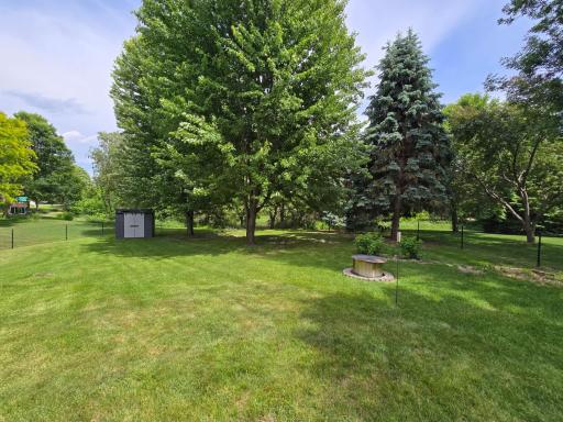 Well landscaped yard with mature trees includes with the home a Brand NEW this year storage shed !