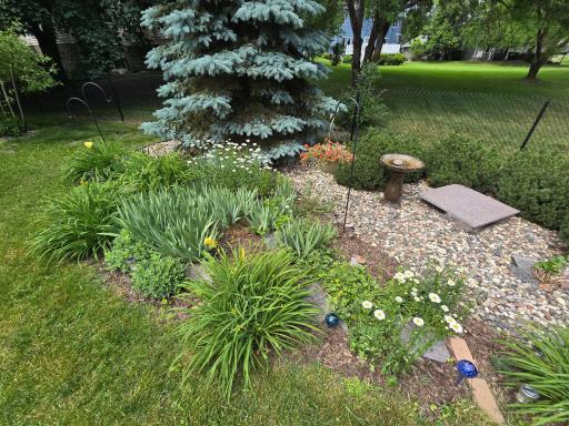 Lots of loving care in the backyard flower bed area.