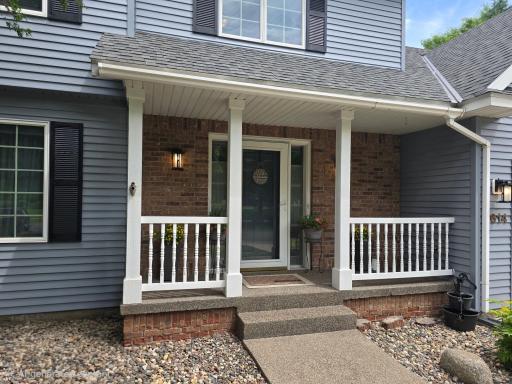 Front porch washed stone. Lots of stone in the surrounding landscaping.