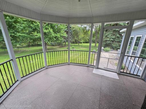 Deck without table and chairs facing walkway to hot tub and back yard. Enjoy the view from the granite floor deck covering.