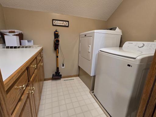 On the upper level and convenient to the 4 bedrooms is the Laundry Room with storage and folding table