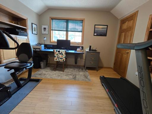 The forth bedroom is currently utilized as a cozy home office and is about the insulated garage area