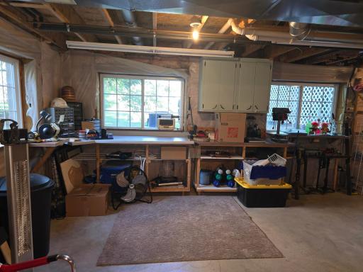 Lower level with direct view of the back yard area currently is workbench friendly but could become a 5th and 6th Bedroom with another bathroom