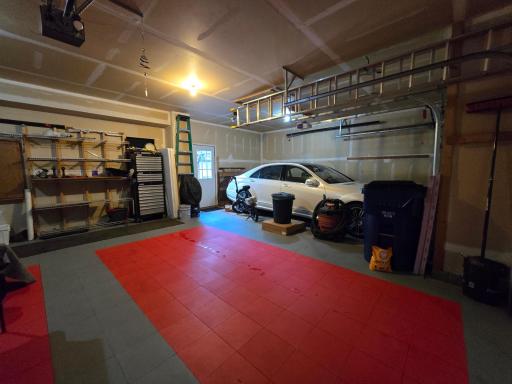 Very special tiles for auto stalls is in the two car portion of the home. The third stall was used for collector car storage and gearhead work. Double car concrete is clean under the tiles and third uncovered stall does have some blemishes.